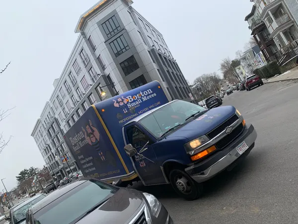 Moving truck outside an urban apartment building