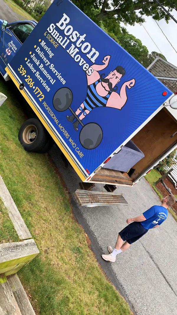 Crew member beside the open moving truck in Harwich