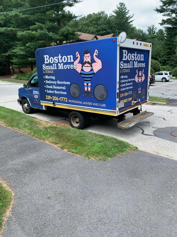 Boston Small Moves truck parked along a leafy residential road