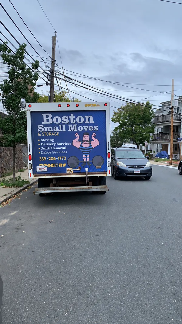 Boston Small Moves truck on a residential street in Somerville